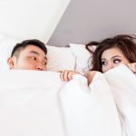 couple in bed what is good postnatal sex